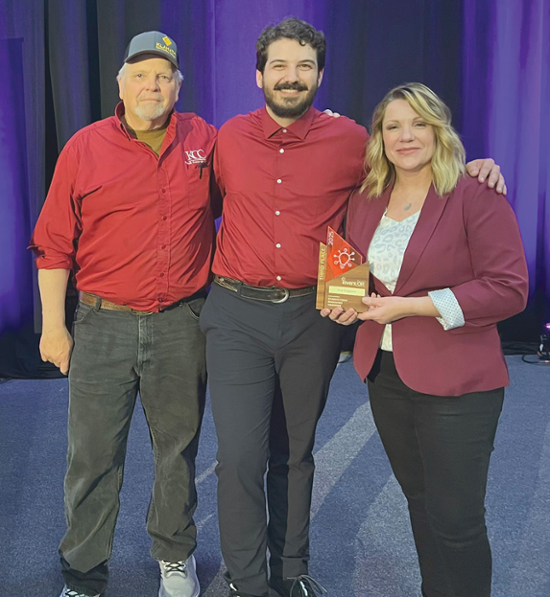 KCC welding instructor Matt Walter, left, who coached Team Fire Stoppers, his son Niles and Melaine McClure pose with their third-place award at the InventOR competition at the University of Portland June 26-27.